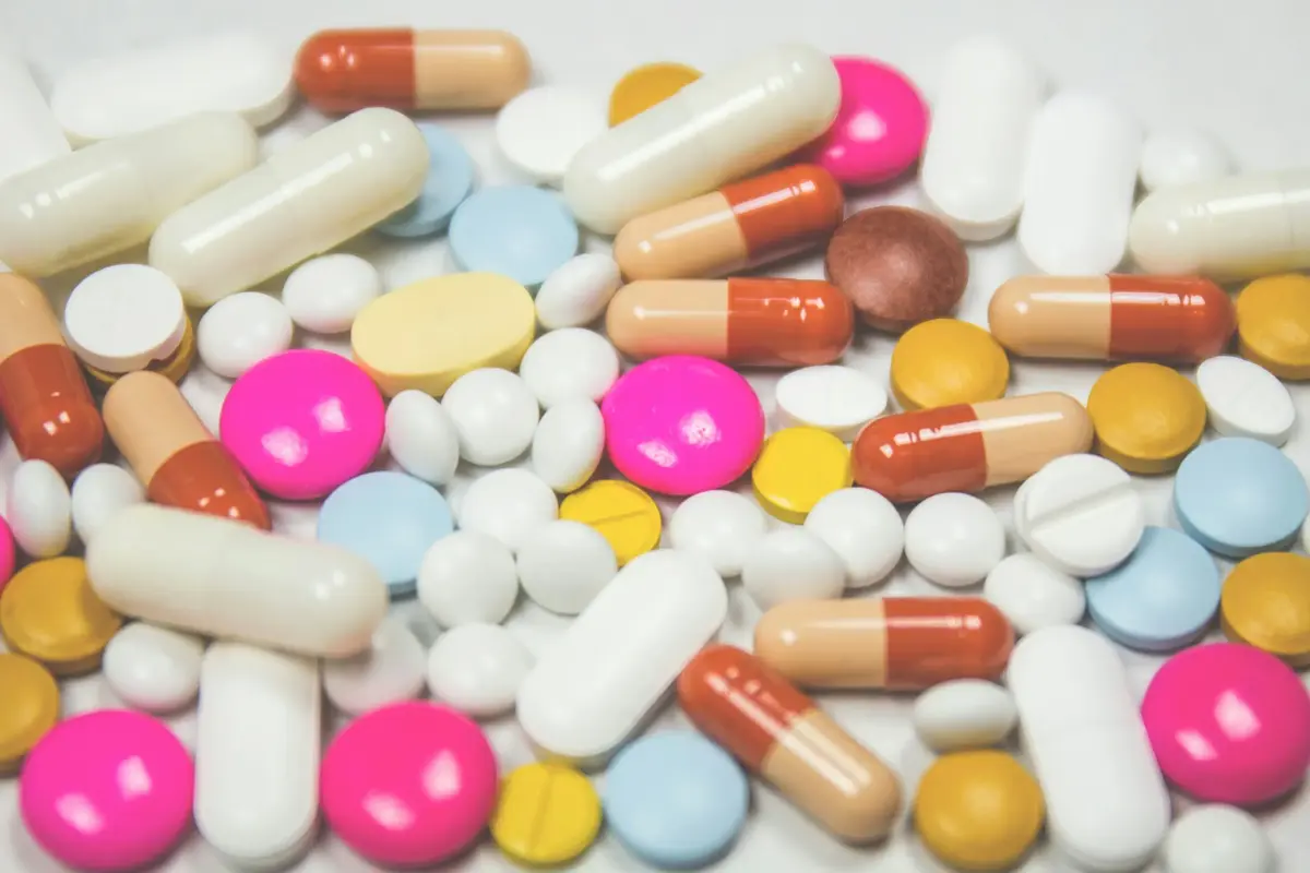 Assorted medication and capsules, the kind of everyday repeat script a pharmacy customer relies on