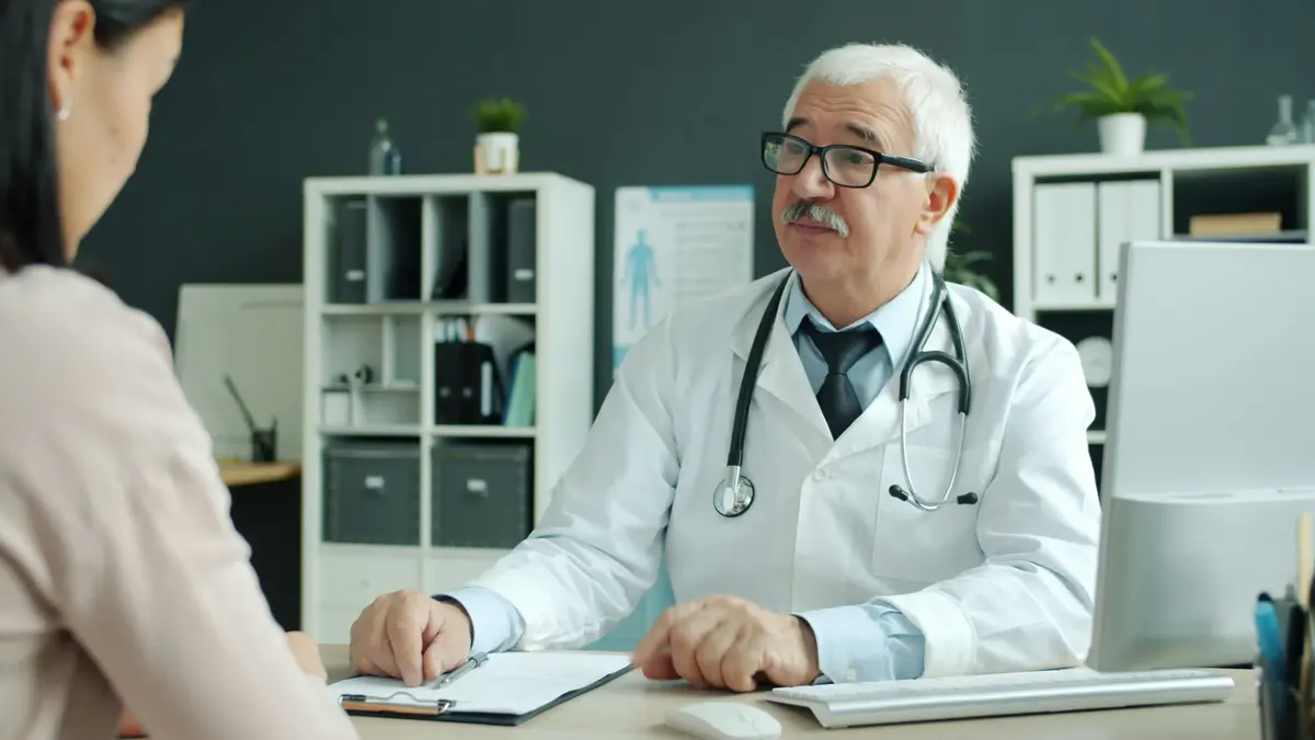 Doctor consulting with a patient in a private practice office in South Africa